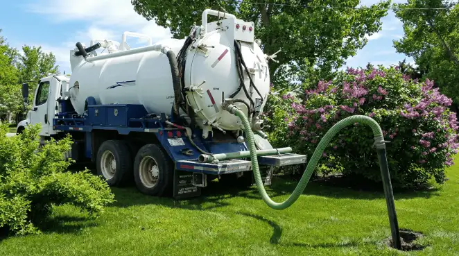 Professional vacuum truck performing residential drainage and septic maintenance in Charlotte, NC